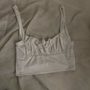 white silky bustier like top
